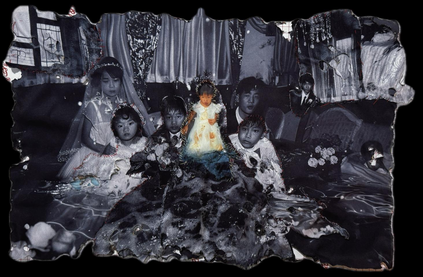 Noah's Wedding — a torn, burned collage of cloth, thread and photograph, figures in wedding dress emerging from dark fabric.