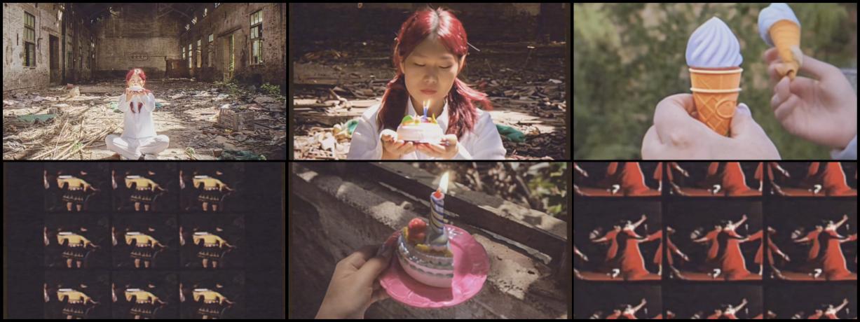 The Wish-01 — a figure in white sits cross-legged in an abandoned factory, holding a toy cake.